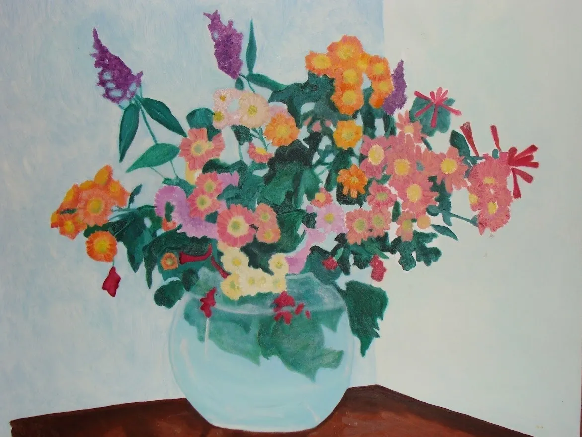 Colorful flowers in round glass vase