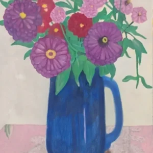 Blue pitcher holding pink, purple, red flowers